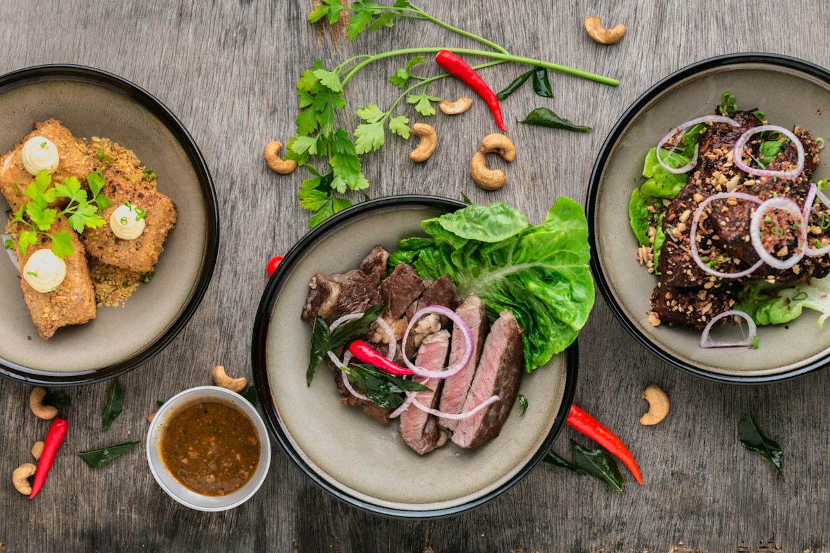 Executive chef tasting presentation featuring artisanal dim sums, slow-cooked dal, and royal entrees